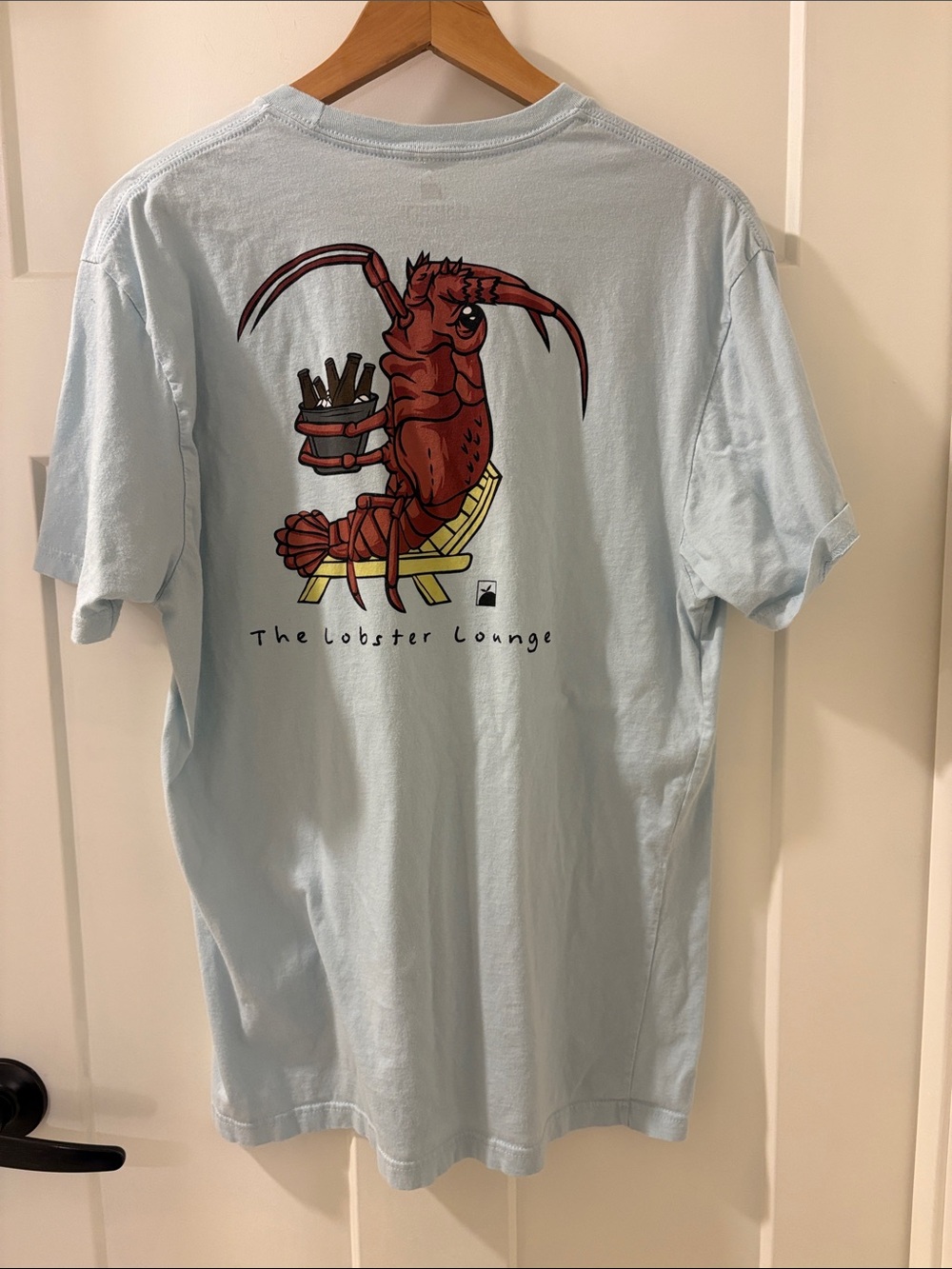 The Lobster Lounge Graphic Tee — Light Blue Short Sleeve Shirt